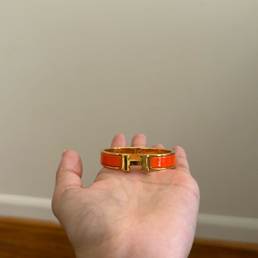 Hermes clic h bracelet in orange and gold
